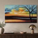 Sunset landscape oil painting displayed above a wooden console